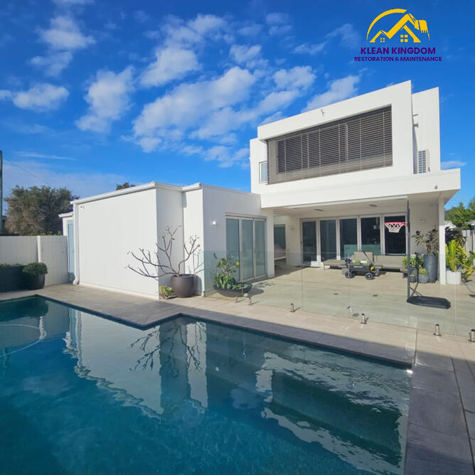 Rear exterior of a modern home in Keeyeema, Sydney, after house wash and pool surrounds cleaning by Klean Kingdom