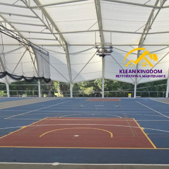 Covered basketball court soft-wash cleaning at a private college in Sydney's north — chewing gum and stain removal by Klean Kingdom